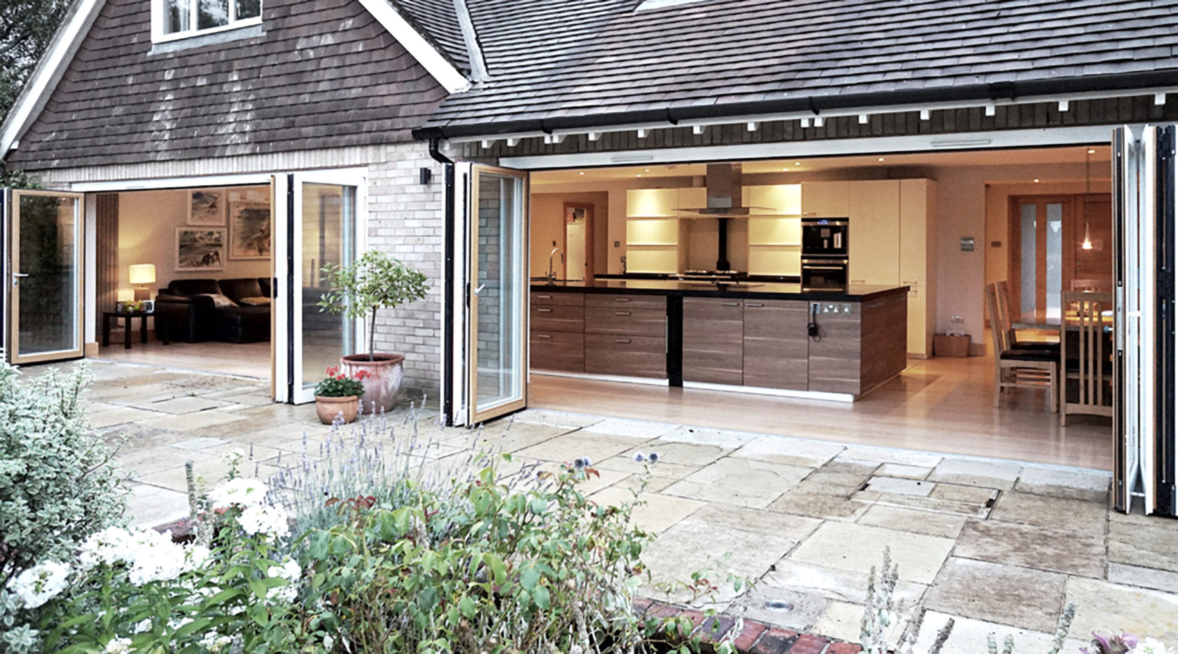 Contemporary Extension doors open in the garden